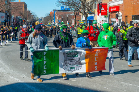 Boston Pipers and Drums band with Highland kilt dress on 2018 Saint Patrick's Day Parade in Boston, Massachusetts MA, USA.のeditorial素材