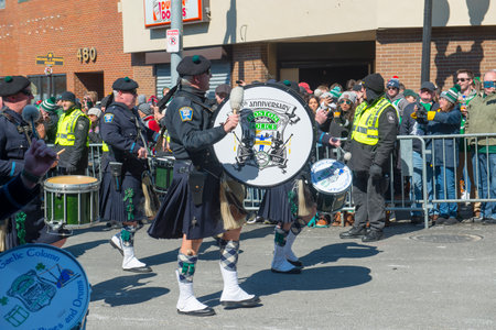 Scottish band drummer with Highland kilt dress on 2018 Saint Patrick's Day Parade in Boston, Massachusetts MA, USA.のeditorial素材