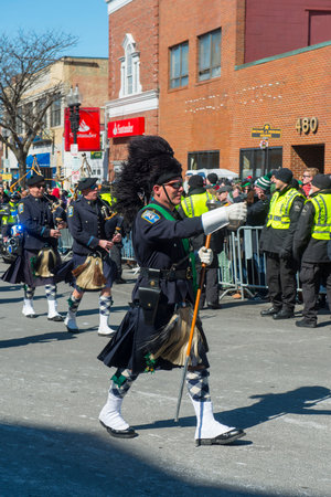 Scottish bagpiper band with Highland kilt dress on 2018 Saint Patrick's Day Parade in Boston, Massachusetts MA, USA.のeditorial素材