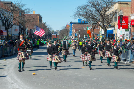 Scottish bagpiper band with Highland kilt dress on 2018 Saint Patrick's Day Parade in Boston, Massachusetts MA, USA.のeditorial素材
