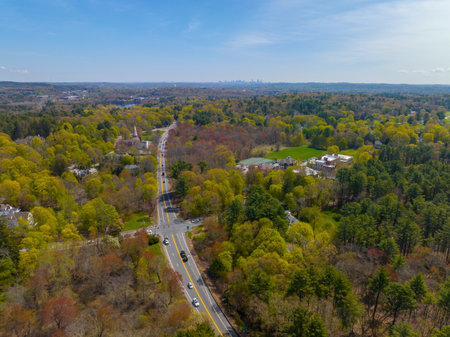 Boston Post Road on US Highway 20 aerial view with Boston Modern city skyline at the background in historic town center of Weston, Massachusetts MA, USA.の写真素材