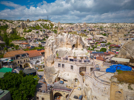 Goreme Town Center historic building with fairy chimney landscape near Goreme National Park in Cappadocia, Anatolia, Nevsehir Province, Turkey.の写真素材