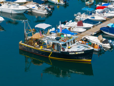 Fishing boat Ocean Reporter aerial view near Motif Number 1 at Rockport Harbor in historic waterfront village of Rockport, Massachusetts MA, USA.のeditorial素材