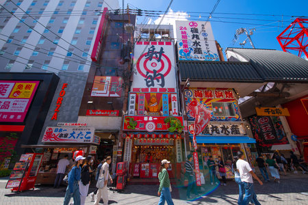 Modern commercial shops and restaurant on Dotonbori Street in Namba District, Chuo ward, city of Osaka, Japan.のeditorial素材
