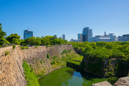 Osaka Castle inner moat and inner wall. Osaka Castle is a Japanese castle in Chuo ward in historic city of Osaka, Japan. It's one of the most famous castle in Japan.の写真素材