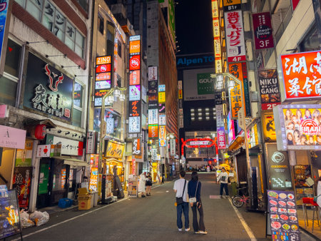 Shops and restaurants at night on Kabukicho Ichiban Gai Street in Shinjuku, Tokyo, Japan.のeditorial素材