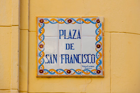 Plaza de San Francisco road sign on the wall at Oficios Street in Old Havana (La Habana Vieja), Cuba. Old Havana is a World Heritage Site.の写真素材