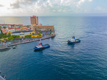 Tugboats aerial view on Sint Anna Bay in Willemstad historic city center, Curacao. Historic Willemstad is a UNESCO World Heritage Site.の写真素材