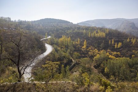 road on mountains in autumnの写真素材