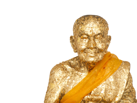 Gold Leaf sheets attached to the Buddha statue isolated from Huay Mongkol Temple, Thailand on white background.の写真素材
