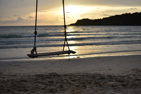 Swing On Ska and sea sunsetの写真素材