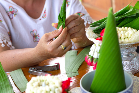Close-up hand made Rice offering,banana leaf, Thailand.の写真素材