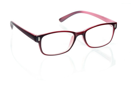 Close-up of red glasses on white 