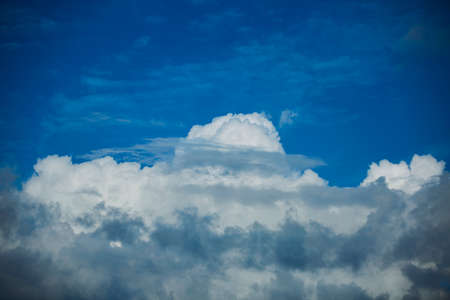 Dramatic Cloudscape in the blue sky. Multiple layers Clouds from far composed of dark and white...