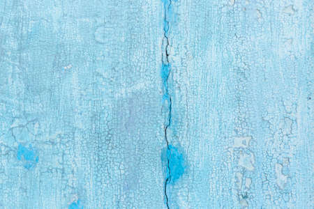 Blue Weathered and painted wooden texture background.