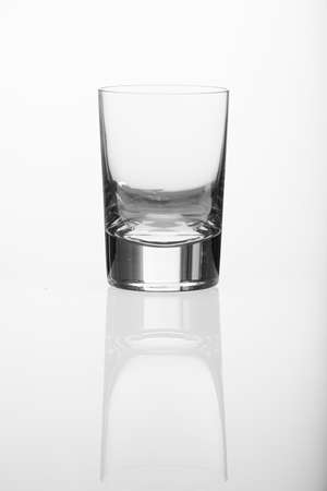 Whiskey glass on a white backgroundの写真素材