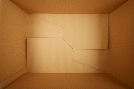 Cardboard paper cube open, close-up studio shot.の写真素材