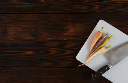 Color carrot with leaves at organic greengrocer's shop. stock photo.の写真素材