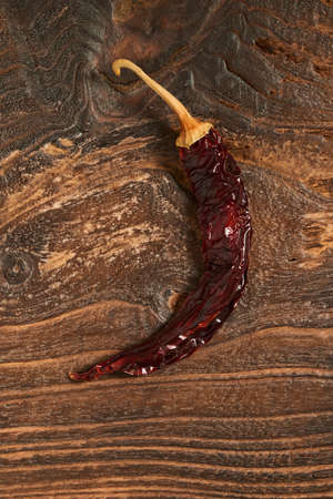 Dried green Pepper on old Wooden background.