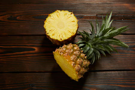 Pineapple slices on wooden backgroundの写真素材