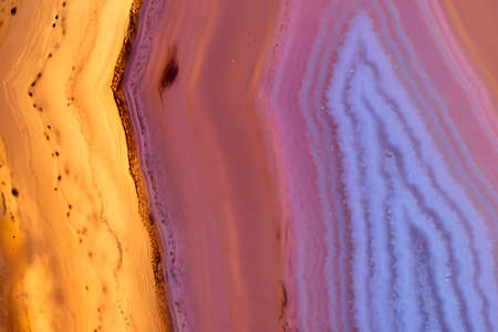 Luxury raw purple Agate Crystal surface texture as a background. Natural pattern surface, Abstract design element of mineral stone macro closeup.の写真素材