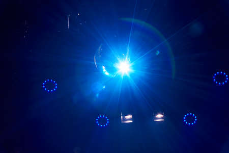 Stage light with colored spotlights and smoke.