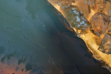 Beautiful curly marble stone with colorful veins.の写真素材