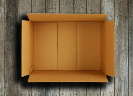 Close up of a Brown box on wooden background.