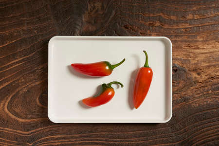 Close-Up of Jalapeno Pepper Against Wooden Backgroundの写真素材