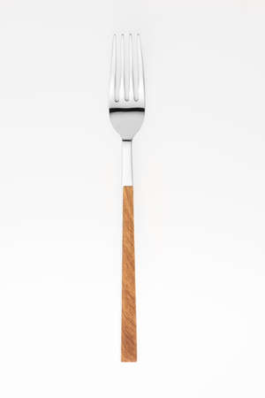 Wooden fork isolated on white background. Studio shot.の写真素材