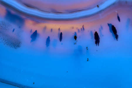 Macro shot of stone crystal on white background close-up.blue.の写真素材