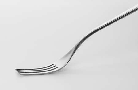Silver fork isolated on white background. Studio shot.の写真素材