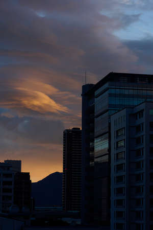Multiple color cloudscape in twilight with sunrise.