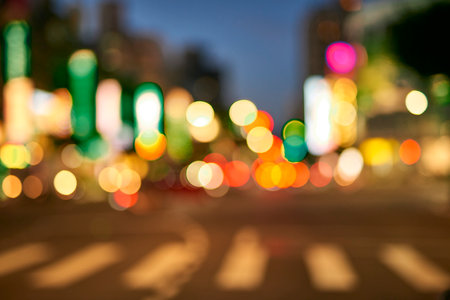 Night bokeh light, blur background of cityscape, blue color toned, abstract.の写真素材