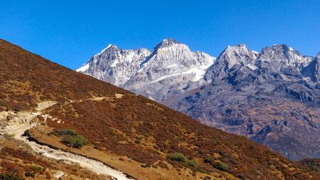 A contrast between dry and rocky mountainsの写真素材