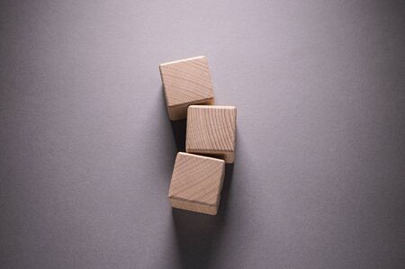 Wooden Geometric Shapes Cube on a paper background , This can use for past your wordsの写真素材