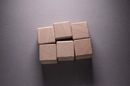 Wooden Geometric Shapes Cube on a paper background , This can use for past your wordsの写真素材