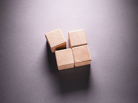 Wooden Geometric Shapes Cube on a paper background , This can use for past your wordsの写真素材