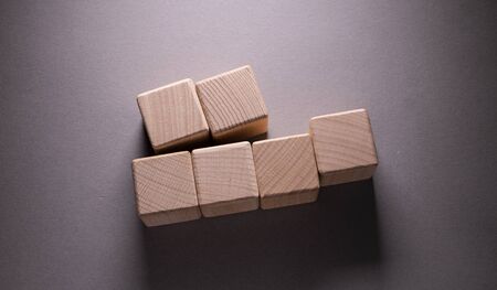 Wooden Geometric Shapes Cube on a paper background , This can use for past your wordsの写真素材