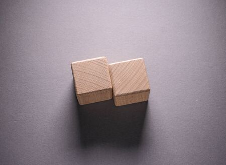 Wooden Geometric Shapes Cube on a paper background , This can use for past your wordsの写真素材