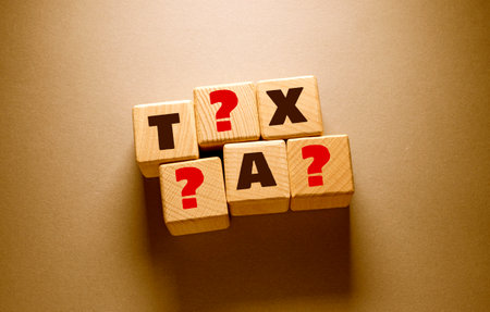 Tax Word Written on Wooden Cubesの写真素材