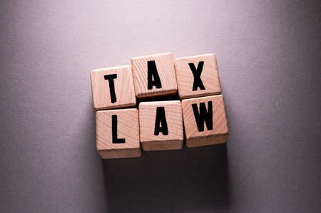 Tax Law Word Written on Wooden Cubesの写真素材
