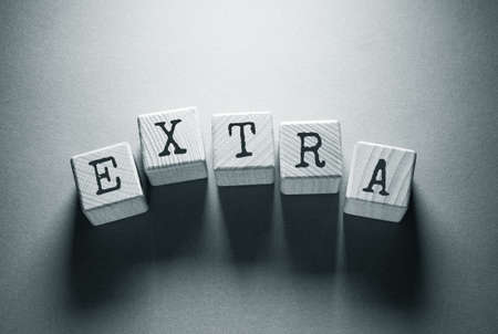 Extra Word Written on Wooden Cubesの写真素材