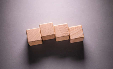 Wooden Geometric Shapes Cube on a paper background , This can use for past your wordsの写真素材