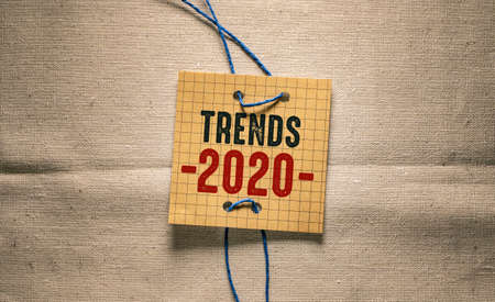 Trends 2020 on a piece of paper on a linen backgroundの写真素材