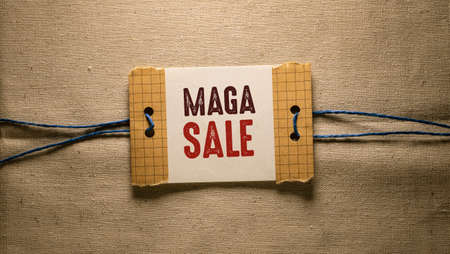 Text sign showing Mega Sale. Conceptual photo Special offer price of a item at a lower or greater value Piece of paper attached to a cord and placed on a wooden backgroundの写真素材