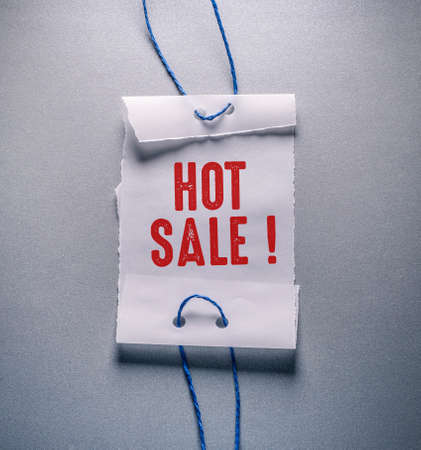 Text showing inspiration Hot Sale. Conceptual photo Discounted price Markdown Promotional Items Crazy Sale Label With String.の写真素材