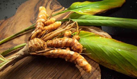 Close up of fresh healthy turmeric in slicesの写真素材