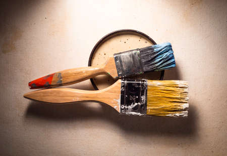 Close up of paint brush on textured wallの写真素材
