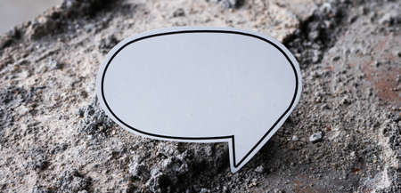 White paper speech bubble on a stone background. 3d rendering.の写真素材